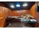 Hobby room with wood paneled walls and train set on a wooden table at 9185 Old Southwick Pass, Johns Creek, GA 30022