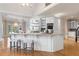 Spacious kitchen island with seating, marble countertops, and stainless steel appliances at 9185 Old Southwick Pass, Johns Creek, GA 30022