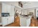 Modern kitchen with stainless steel appliances, granite countertops, and a breakfast bar at 9185 Old Southwick Pass, Johns Creek, GA 30022