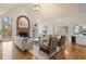 Bright and open living room featuring hardwood floors, fireplace, and access to the kitchen at 9185 Old Southwick Pass, Johns Creek, GA 30022