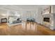 Spacious main bedroom features a fireplace, hardwood floors and large windows with plantation shutters at 9185 Old Southwick Pass, Johns Creek, GA 30022
