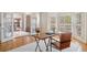 Bright office featuring hardwood floors, french doors, and modern furnishings at 9185 Old Southwick Pass, Johns Creek, GA 30022