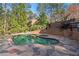 Inviting backyard pool area with brick accents and lush landscaping at 9185 Old Southwick Pass, Johns Creek, GA 30022