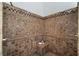 Tiled shower features multiple showerheads, built-in bench, and a decorative tile border at 9185 Old Southwick Pass, Johns Creek, GA 30022