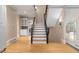 Elegant staircase with hardwood steps and wrought iron railings at 9185 Old Southwick Pass, Johns Creek, GA 30022