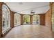 Sunroom with brick walls, arched windows, and glass doors leading to the backyard at 9185 Old Southwick Pass, Johns Creek, GA 30022