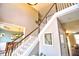 Bright foyer with soaring ceilings, a staircase with white rails, and an open floor plan at 1023 Hawk Creek Trl, Lawrenceville, GA 30043