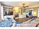 Cozy living room featuring a fireplace, hardwood floors, built-in bookshelves and exposed beam at 1023 Hawk Creek Trl, Lawrenceville, GA 30043