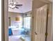 Bright bathroom featuring a glass enclosed shower, garden tub, and a blue vanity sink at 1023 Hawk Creek Trl, Lawrenceville, GA 30043