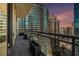 Spacious balcony offering sunset views of the city skyline and surrounding buildings at 1065 Peachtree Ne St # 2901, Atlanta, GA 30309