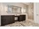 Modern bathroom featuring double vanity, a large mirror, and a glass-enclosed shower at 1065 Peachtree Ne St # 2901, Atlanta, GA 30309