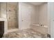 Luxurious bathroom featuring a soaking tub, glass-enclosed shower, and upscale finishes at 1065 Peachtree Ne St # 2901, Atlanta, GA 30309