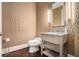 Elegant half bathroom featuring patterned wallpaper, stone vanity, and modern lighting at 1065 Peachtree Ne St # 2901, Atlanta, GA 30309