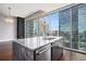 Kitchen island with stainless steel dishwasher and floor to ceiling windows at 1065 Peachtree Ne St # 2901, Atlanta, GA 30309