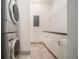 Well-equipped laundry room with stainless steel washer and dryer, and cabinetry at 1065 Peachtree Ne St # 2901, Atlanta, GA 30309