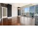 Spacious living room featuring hardwood floors, floor to ceiling windows, and modern chandelier at 1065 Peachtree Ne St # 2901, Atlanta, GA 30309