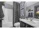 Stylish bathroom featuring a shower with tub, modern vanity, and decorative accents at 120 Sunflower Ln, Covington, GA 30016