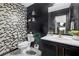 Chic half bathroom with modern fixtures and geometric wallpaper at 120 Sunflower Ln, Covington, GA 30016