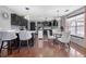 Modern eat-in kitchen featuring dark cabinets, stainless appliances, and decorative lighting at 120 Sunflower Ln, Covington, GA 30016