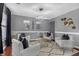 Cozy living room with plush white armchairs, modern decor, and hardwood flooring at 120 Sunflower Ln, Covington, GA 30016