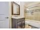 Cozy bathroom with a shower-tub combo, a granite vanity, and a framed mirror for a stylish space at 2417 Siesta Ct, Marietta, GA 30062