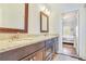 Bathroom with double vanity, granite countertops, and framed mirrors at 2417 Siesta Ct, Marietta, GA 30062