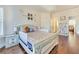 Well-lit bedroom featuring a decorative bed frame and hardwood floors at 2417 Siesta Ct, Marietta, GA 30062