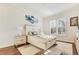 Bright bedroom with plush bed, patterned rug, and natural light from window at 2417 Siesta Ct, Marietta, GA 30062