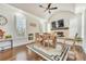 Bright dining room with hardwood floors, fireplace, modern rug, and plantation shutters at 2417 Siesta Ct, Marietta, GA 30062