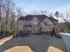 A charming home boasting a manicured lawn, stone accents, and a welcoming front entrance at 2417 Siesta Ct, Marietta, GA 30062