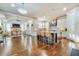 Bright open kitchen with large island, stainless vent hood, white cabinets, and hardwood floors at 2417 Siesta Ct, Marietta, GA 30062