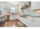 Modern kitchen features stainless steel appliances, mosaic tile backsplash, and hardwood floors at 2417 Siesta Ct, Marietta, GA 30062