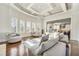 Open-concept living room with tall windows, coffered ceiling, and view into the kitchen at 2417 Siesta Ct, Marietta, GA 30062