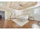 Large main bedroom with tray ceiling, hardwood floors, and windows with plantation shutters at 2417 Siesta Ct, Marietta, GA 30062