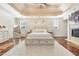 Spacious main bedroom with tray ceiling, fireplace, and large windows with plantation shutters at 2417 Siesta Ct, Marietta, GA 30062