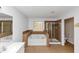 Bright bathroom featuring a garden tub, tiled shower, window and toilet at 499 Bellbrook Ln, Lawrenceville, GA 30045