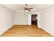 Bedroom features a ceiling fan, two windows, tray ceiling, and an open doorway at 499 Bellbrook Ln, Lawrenceville, GA 30045