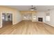 Spacious living room with wood floors, fireplace, and natural light from the windows at 499 Bellbrook Ln, Lawrenceville, GA 30045