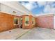 Covered patio featuring a brick facade and concrete flooring at 499 Bellbrook Ln, Lawrenceville, GA 30045