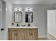 Stylish bathroom with double vanity, black hardware, and modern lighting at 5393 Ridge Forest Dr, Stone Mountain, GA 30083