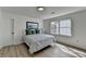 Sun-filled bedroom features wood floors, white walls and a large window at 5393 Ridge Forest Dr, Stone Mountain, GA 30083