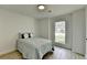 Bright bedroom with wood floors, window, and soft, inviting bedding at 5393 Ridge Forest Dr, Stone Mountain, GA 30083