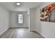 Bright, spacious bedroom with art and wood floors at 5393 Ridge Forest Dr, Stone Mountain, GA 30083