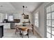 Bright dining area with a wooden table, natural light, and views to the backyard at 5393 Ridge Forest Dr, Stone Mountain, GA 30083