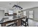 Open concept kitchen with an island with seating, lots of light, and white cabinets at 5393 Ridge Forest Dr, Stone Mountain, GA 30083