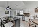 Modern kitchen with a large island, sleek countertops, and white cabinets at 5393 Ridge Forest Dr, Stone Mountain, GA 30083