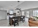 Open concept living room featuring an island with seating, lots of natural light and a sofa at 5393 Ridge Forest Dr, Stone Mountain, GA 30083