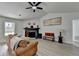 Inviting living room with a fireplace, comfortable seating, and natural light at 5393 Ridge Forest Dr, Stone Mountain, GA 30083