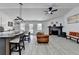 Open concept living room with vaulted ceiling, fireplace, island and dining area at 5393 Ridge Forest Dr, Stone Mountain, GA 30083