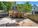 Backyard view featuring a deck with stairs, lawn, trees, and exterior of home at 609 Old Wheat Ne St, Atlanta, GA 30312